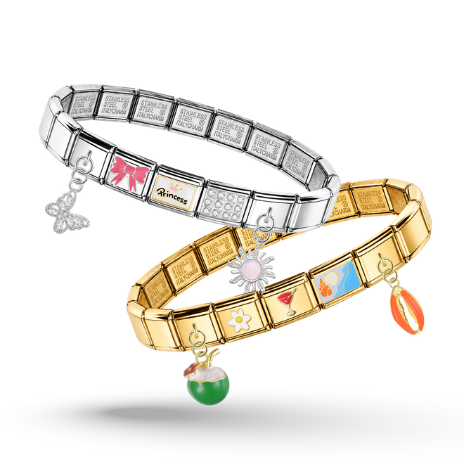 Two charm bracelets, one in silver and one in yellow gold, displayed on a clean white background. The silver bracelet features a butterfly charm and a pink sun charm, while the gold bracelet features a flower charm, a blue beach umbrella charm, and an orange sun charm.