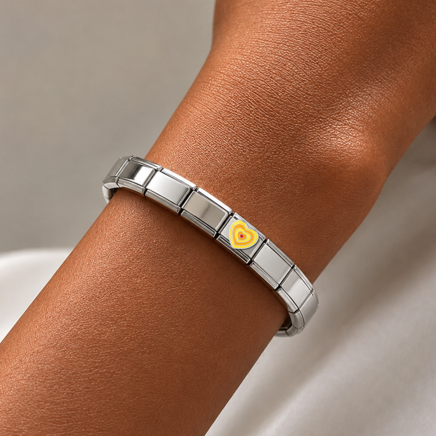 Fluttering Yellow Heart – silver Italian charm worn on an Italian charm bracelet