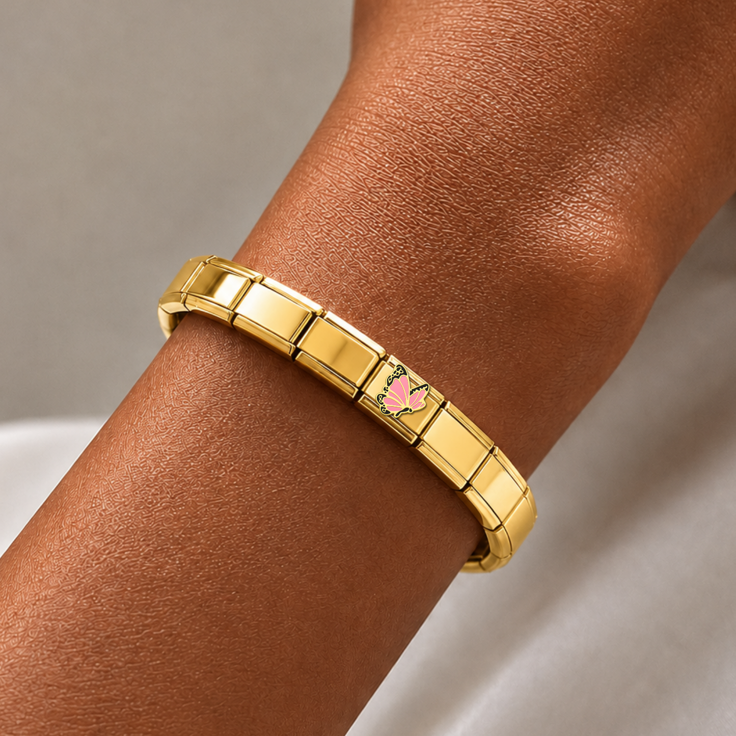 Pink Butterfly – gold Italian charm worn on an Italian charm bracelet