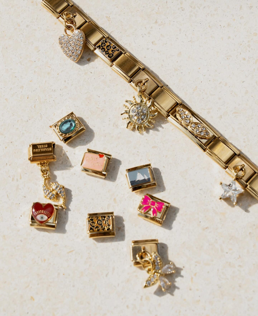 Italycharm bracelet in a cocktail glass by the pool