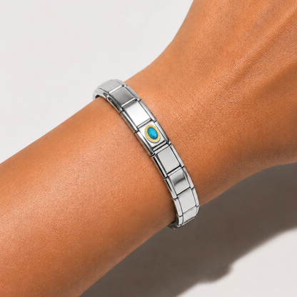 Royal Aquamarine Resin – silver Italian charm worn on an Italian charm bracelet