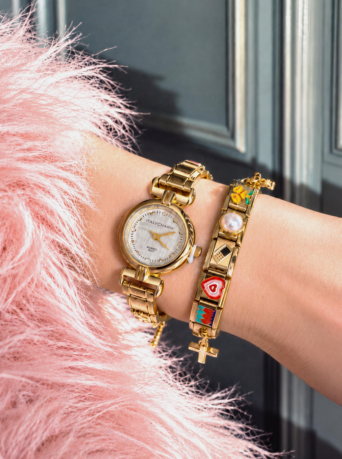 Italycharm watch and charm bracelet worn with a pink faux-fur sleeve